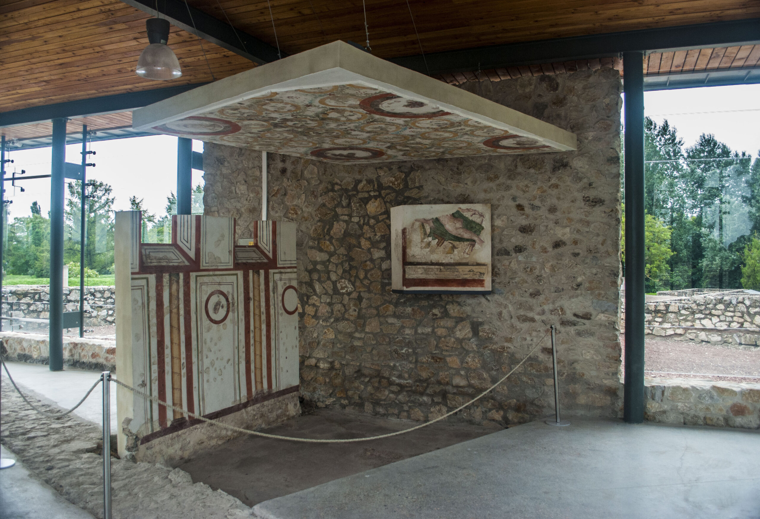 Roman wall frescoes recovered from Gorsium-Herculia at Tac, with red and ochre painted panels displayed in the site museum.