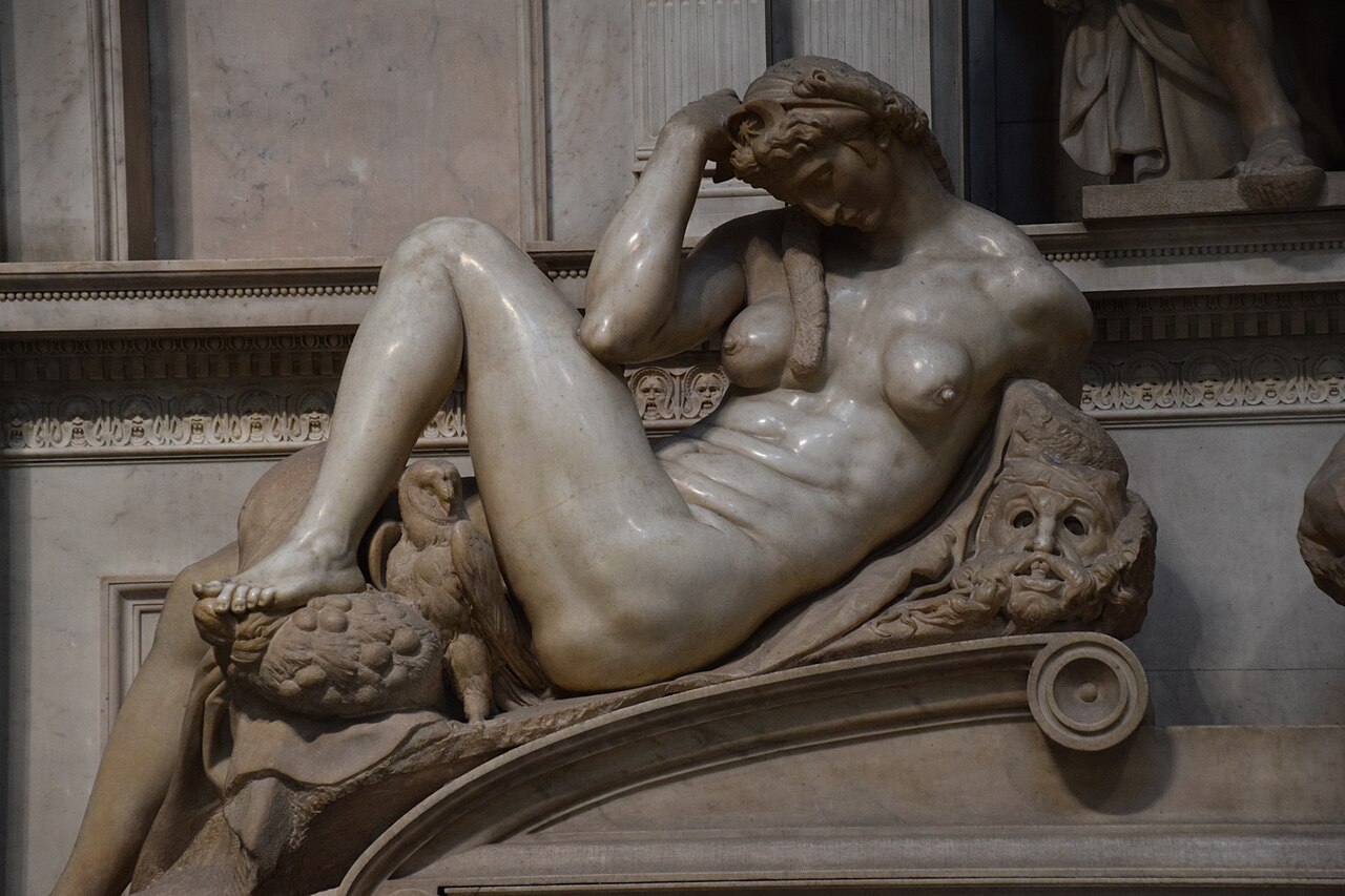 Michelangelo's marble statue Night, a reclining female nude with an owl, mask and poppies, on the tomb of Giuliano de' Medici