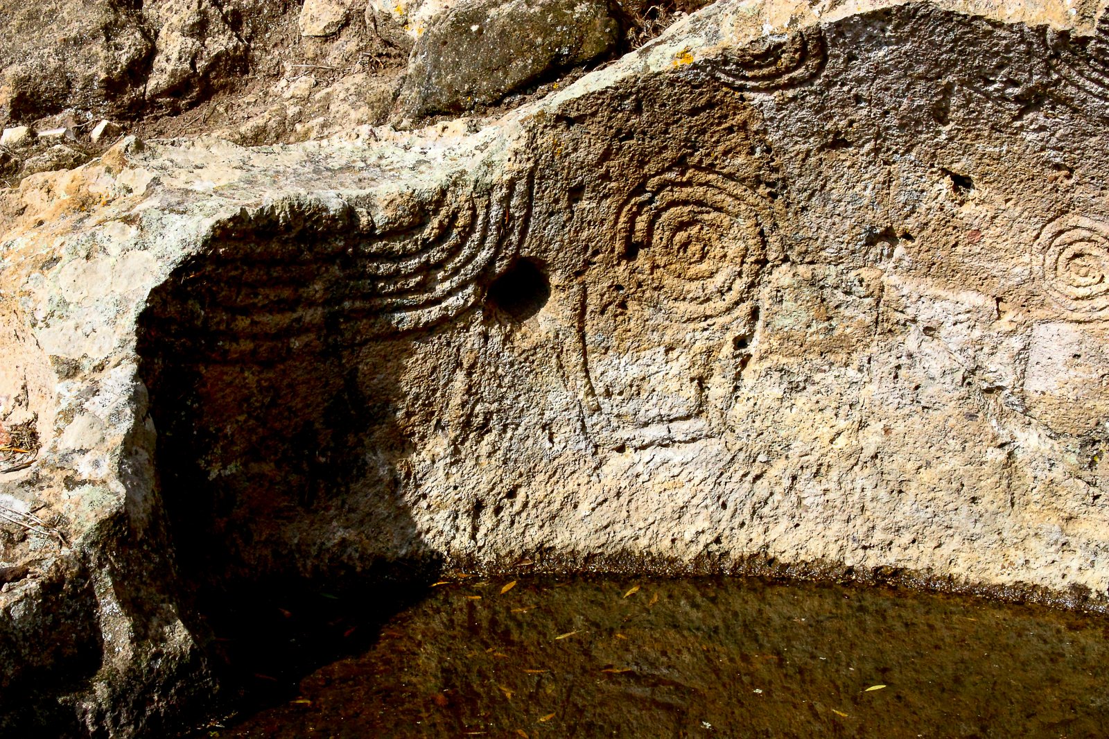 Carved spirals, festoons and frames decorating the interior of the Tomb of the Spirals at the Montessu necropolis, Sardinia