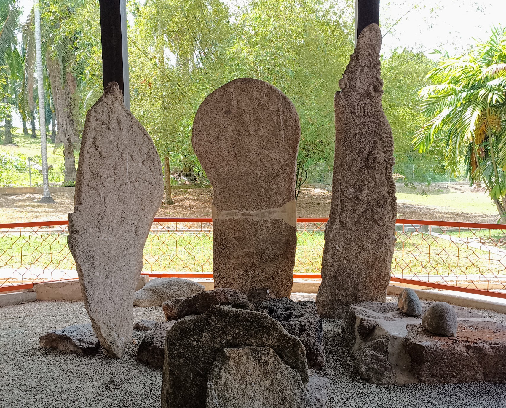 The three carved granite menhirs of Pengkalan Kempas, nicknamed the sword, spoon and rudder stones