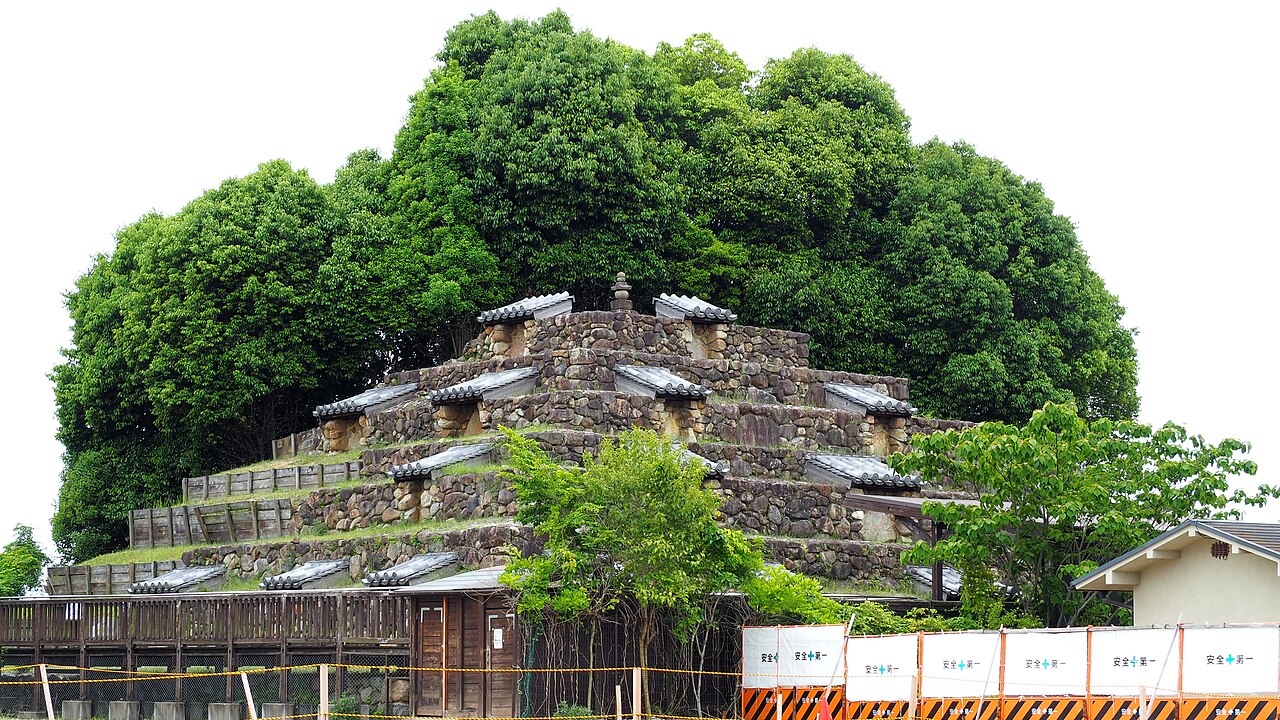 The restored northern half of the Zuto earthen step pyramid in Takabatake, Nara, showing seven stone-faced tiers built in 767 CE