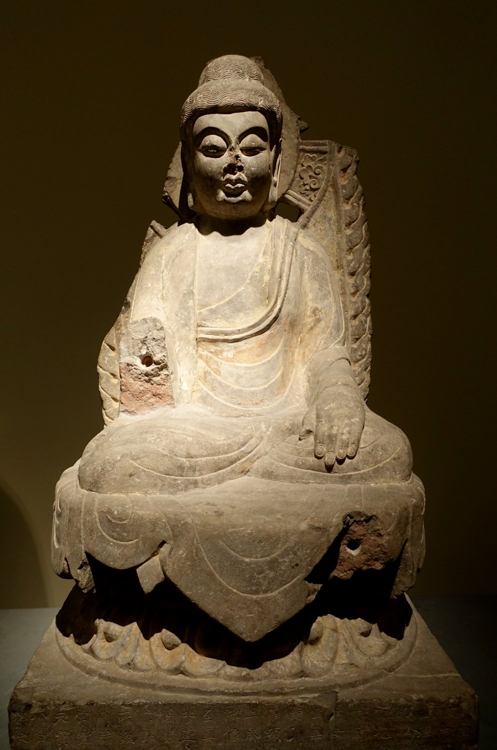 Grey-limestone seated Amitabha Buddha, China, Tang dynasty, dated 746 CE, in the Ethnological Museum, Berlin