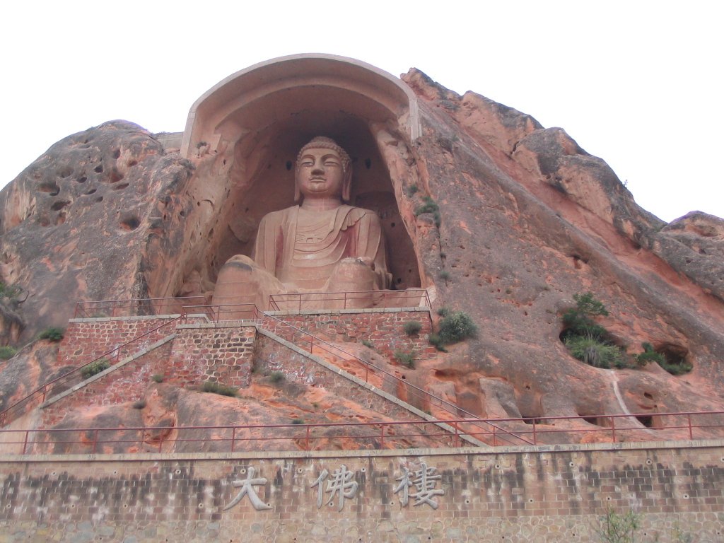 The roughly 20-metre Tang colossal seated Buddha in the Great Buddha Tower of Cave 5 at the Xumishan Grottoes, Ningxia, China