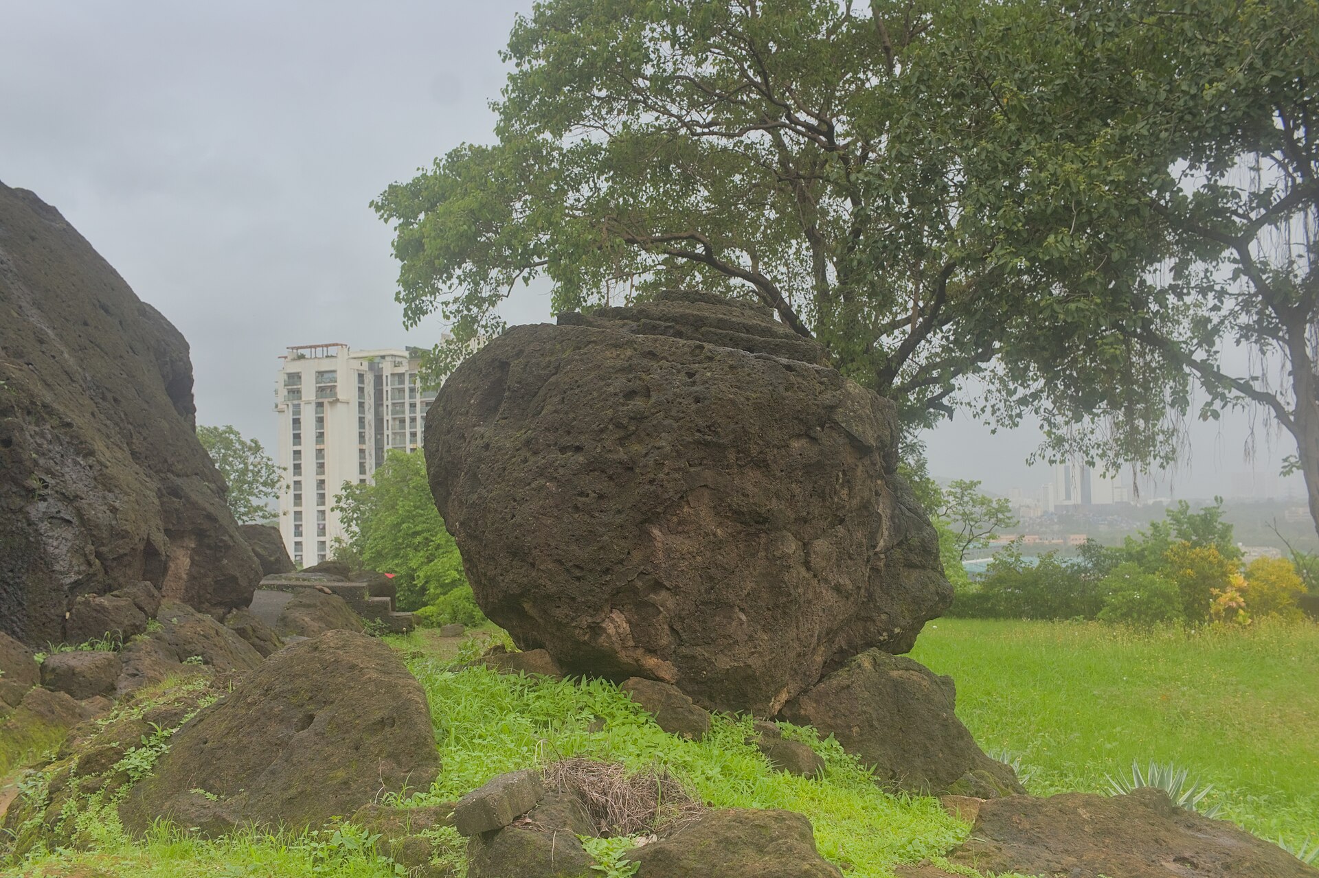 Unfinished rock-cut sculpture in front of Cave 2 at the Kondivite Caves, Mumbai.