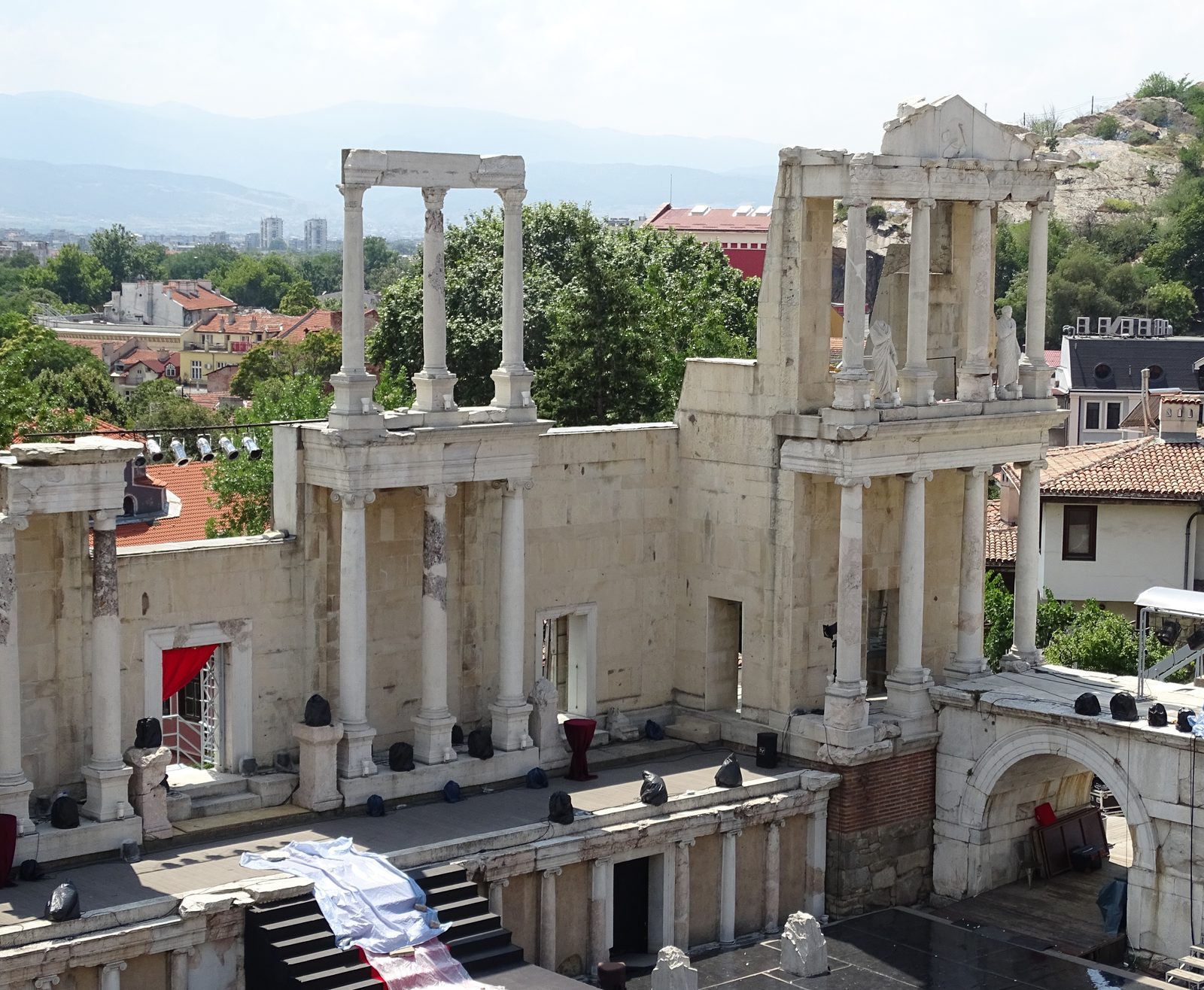 Marble seating rows of the cavea of the ancient theatre of Philippopolis in Plovdiv, divided by a horizontal walkway.