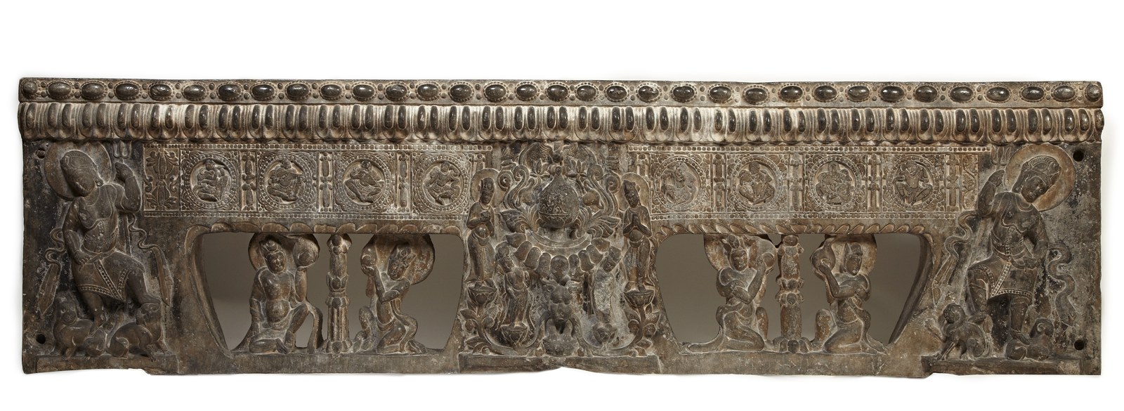 Base of a Sogdian funerary couch carved with musicians and dancers and Buddhist divinities.