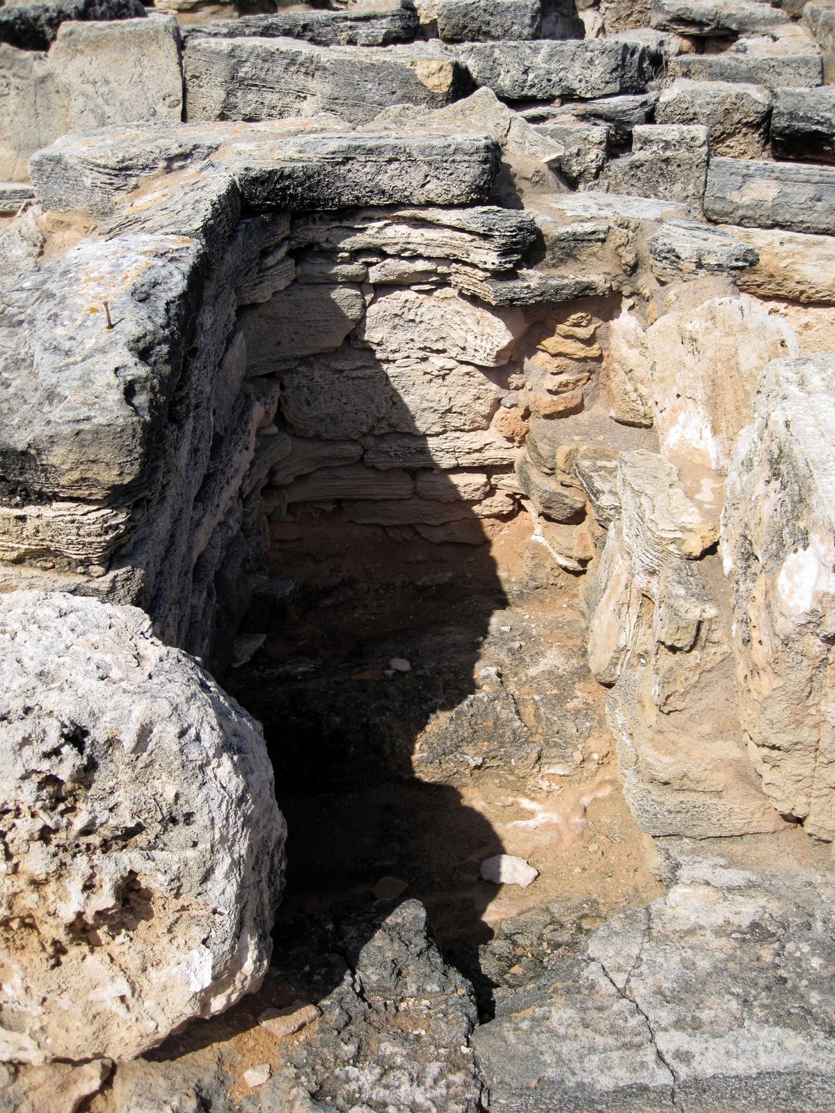 Close view of a single circular Talayotic-style tomb chamber at the Necropolis of Son Real, Mallorca