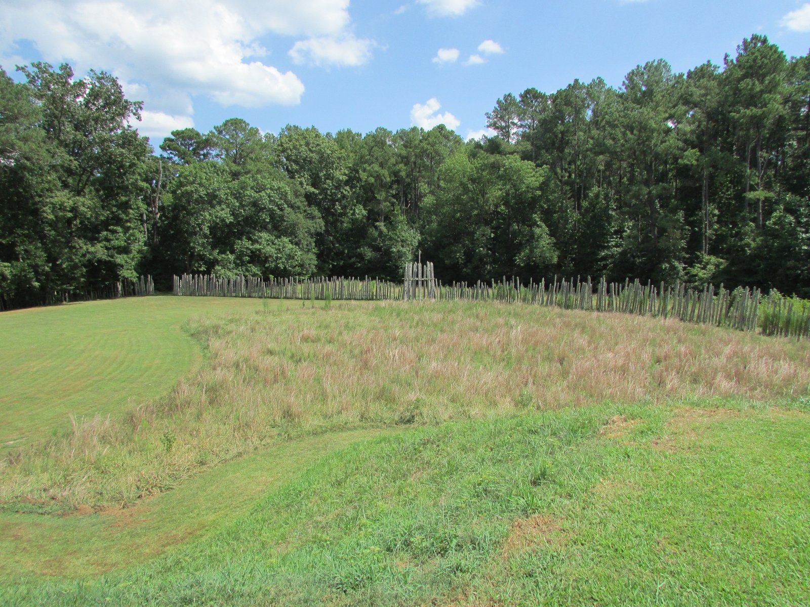 Reconstructed wooden palisade wall and gateway at Town Creek Indian Mound, North Carolina