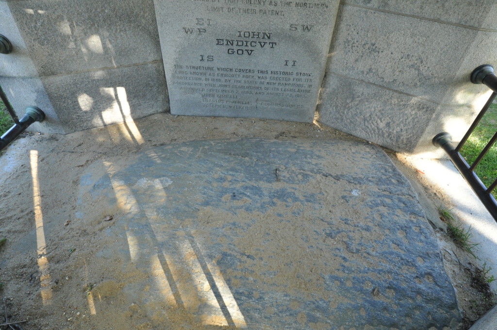 Endicott Rock enclosed in its stone pavilion at Weirs Beach on Lake Winnipesaukee