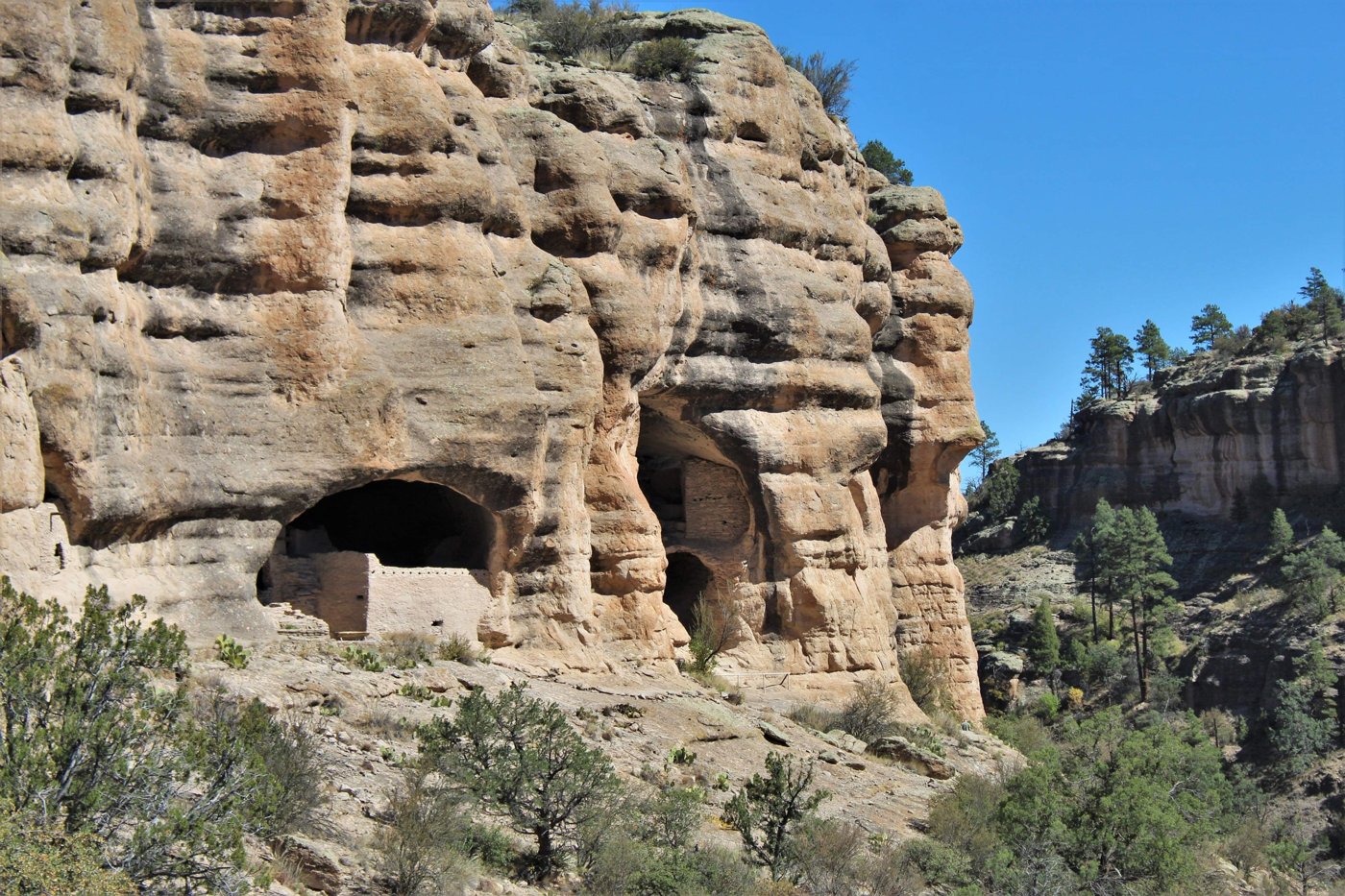 Masonry rooms built inside natural cliff alcoves at Gila Cliff Dwellings National Monument, New Mexico